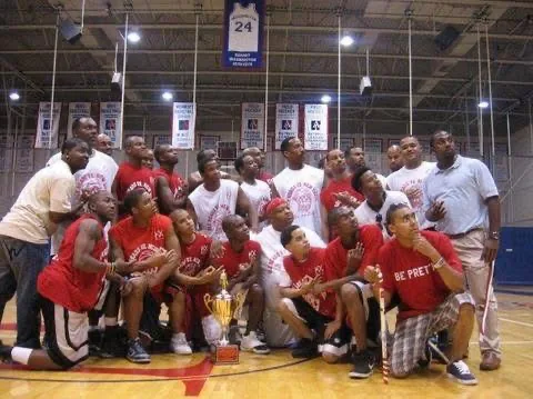 Kappa Chi Brothers with a basketball trophy